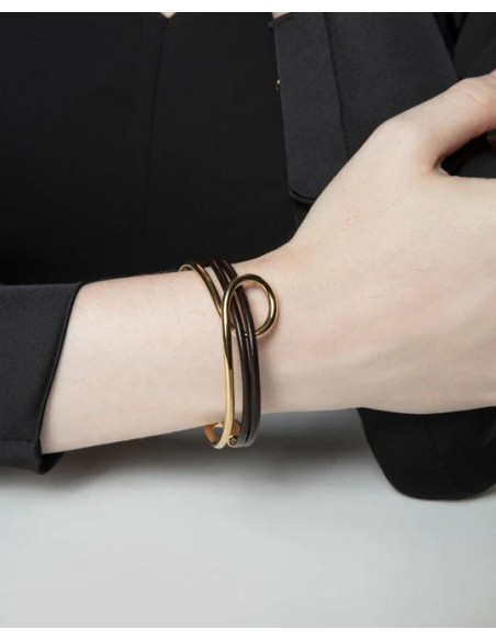 Pulsera de mujer de acero dorado y piel negra